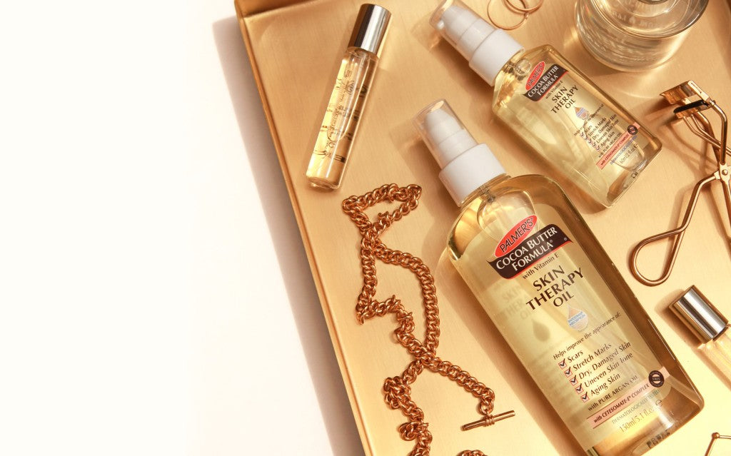 skin therapy oil on tray with jewellery