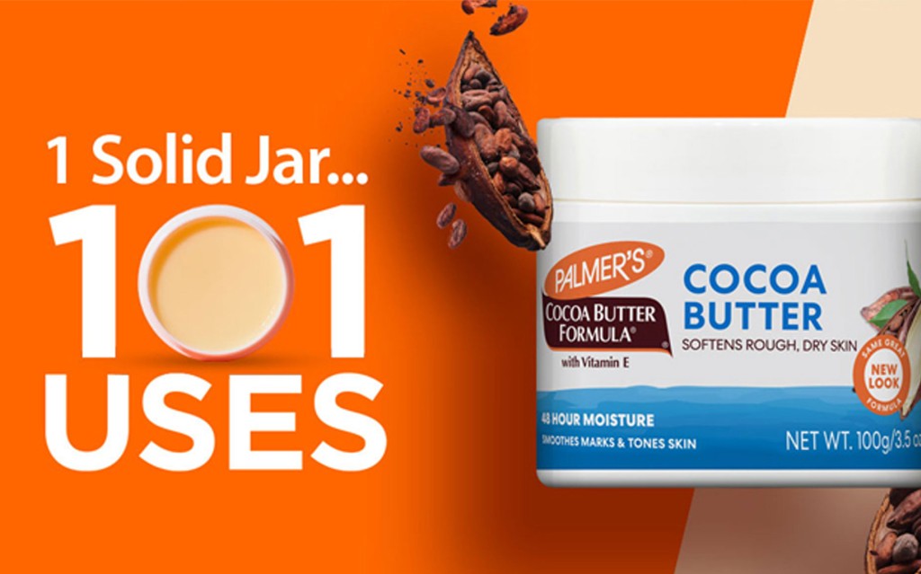 Palmer's Original Solid Jar on table with cocoa beans and cocoa pod