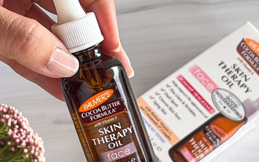 woman holding skin therapy oil