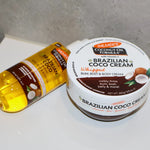 Palmer's Brazilian Coco Whipped Body Cream and Firming Oil shown scattered on a bathroom counter top