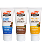 Three tubes of Palmer's hand creams lined up on a white background: Cocoa Butter Hand Cream with blue label, Coconut Hydrate Hand Cream with brown label, and Raw Shea Nourish Hand Cream with yellow label.