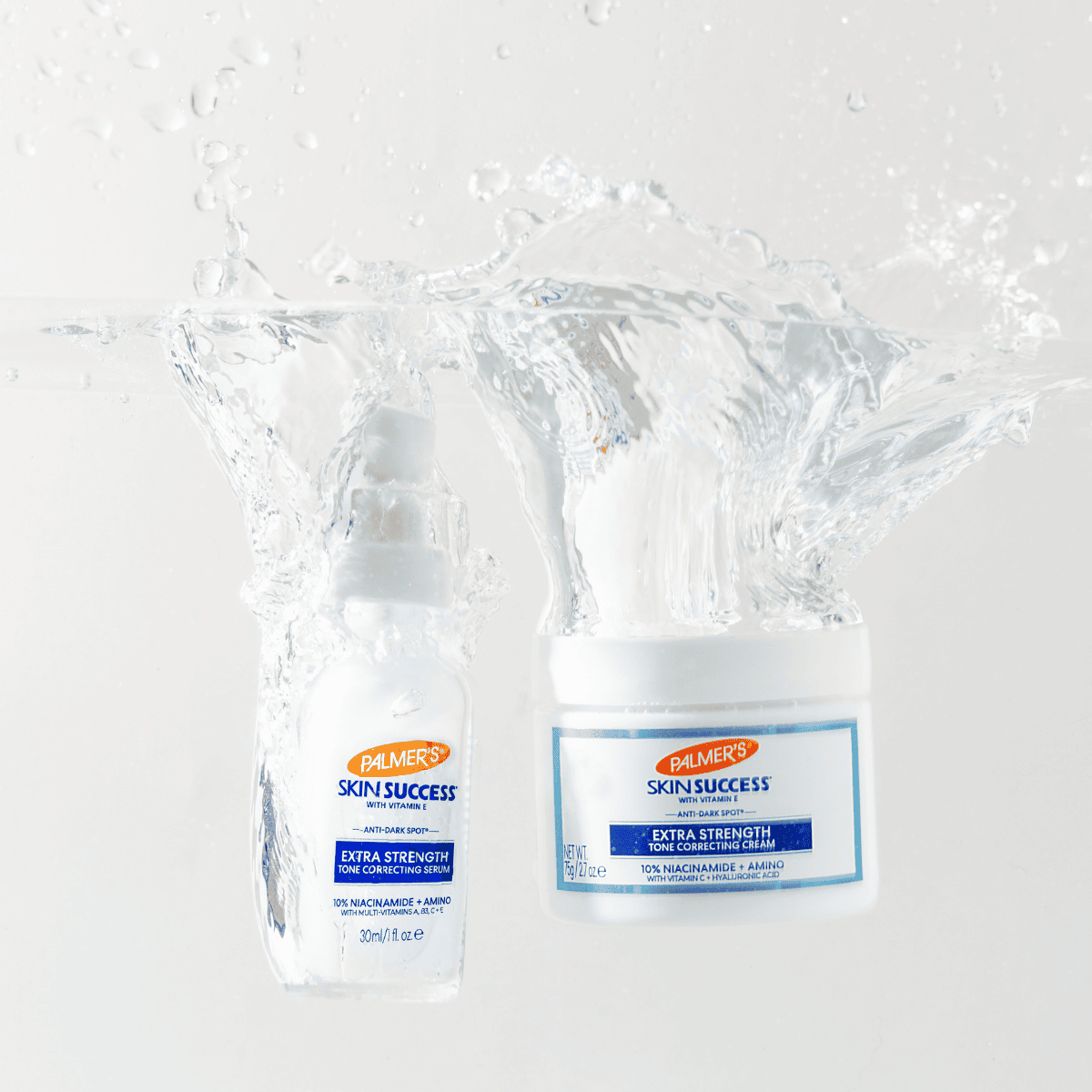 This is a picture of Palmer's Skin Success Extra Strength Cream and Serum being dropped into water.