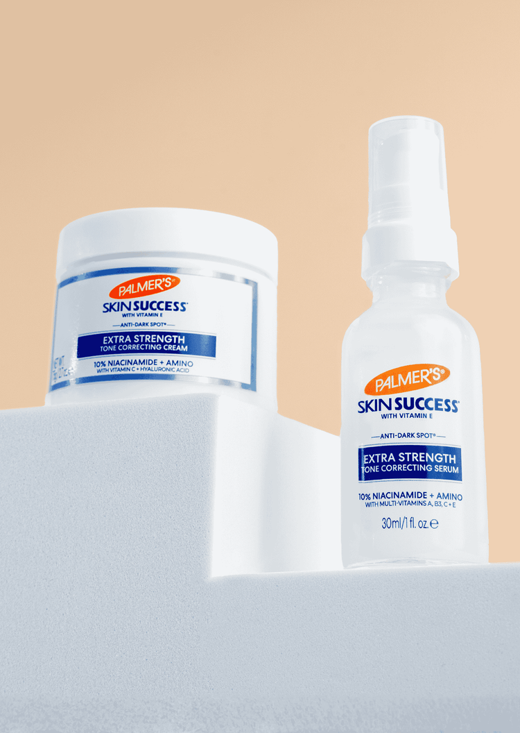 Palmer's Skin Success Extra Strength range shown on white blocks with a peach background.