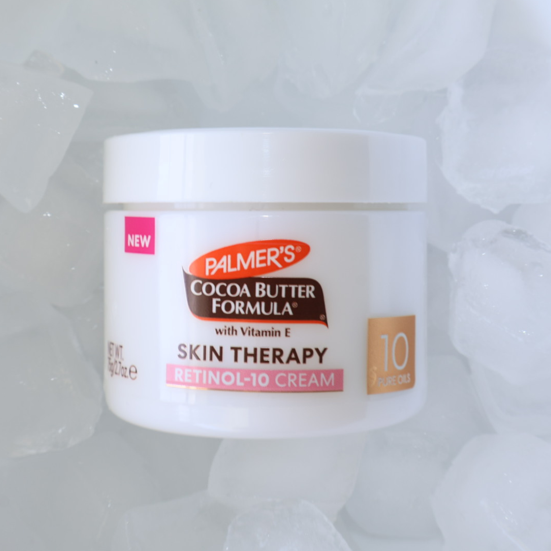 Palmer's Cocoa Butter Formula skin therapy retinol-10 face cream jar on a textured white background