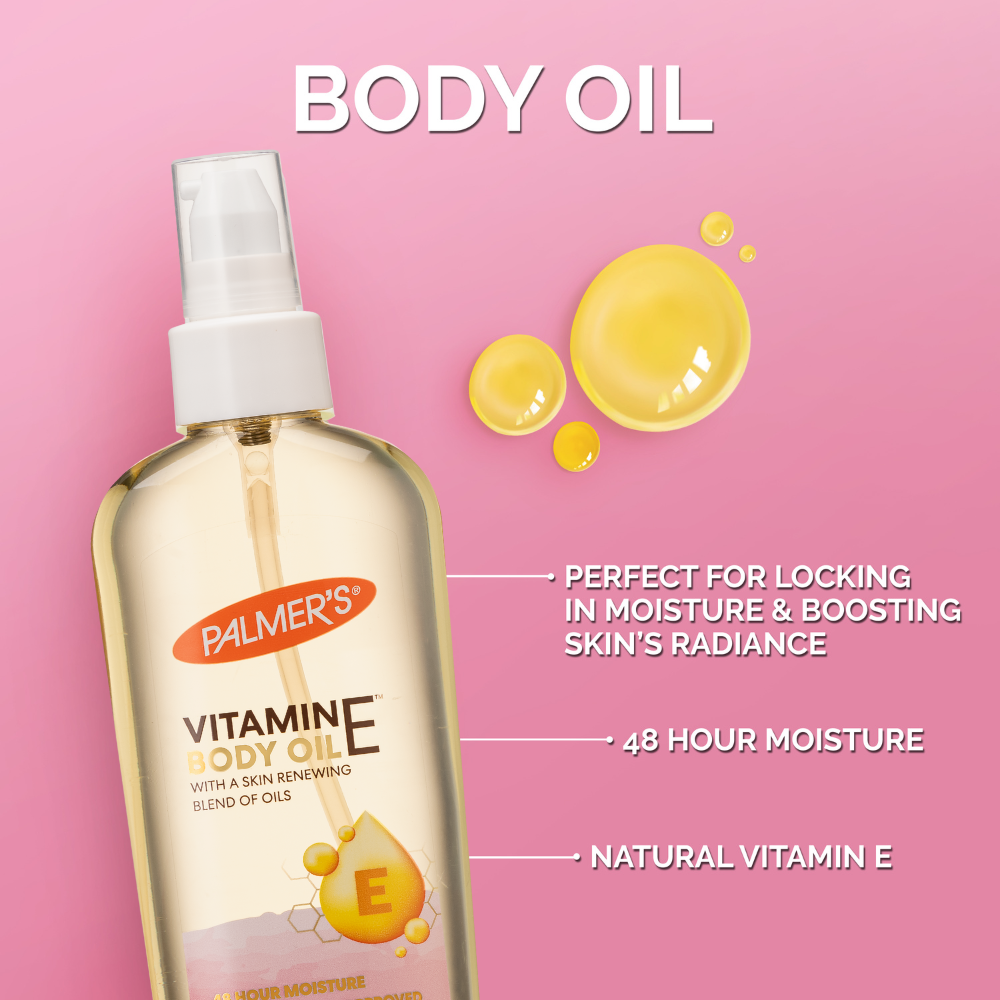 Palmer's Vitamin E body oil bottle with product features on a pink background